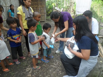 Archived moment from a community feeding, health, or family outreach activity