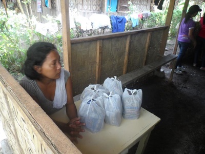 Archived moment from a community feeding, health, or family outreach activity