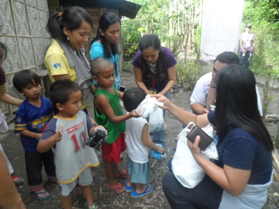 Archived moment from a community feeding, health, or family outreach activity