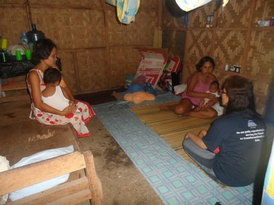 Archived moment from a community feeding, health, or family outreach activity