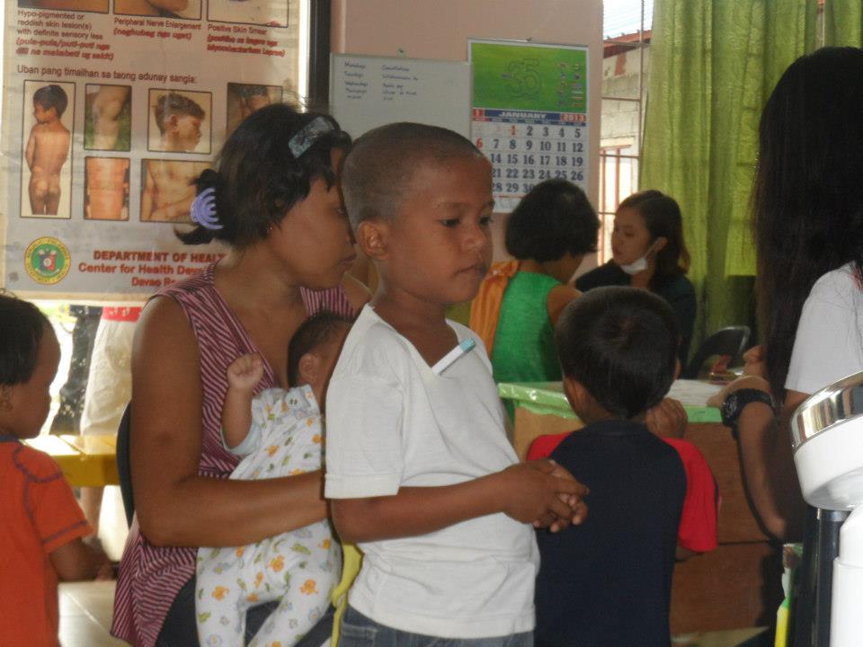 Archived moment from a community feeding, health, or family outreach activity