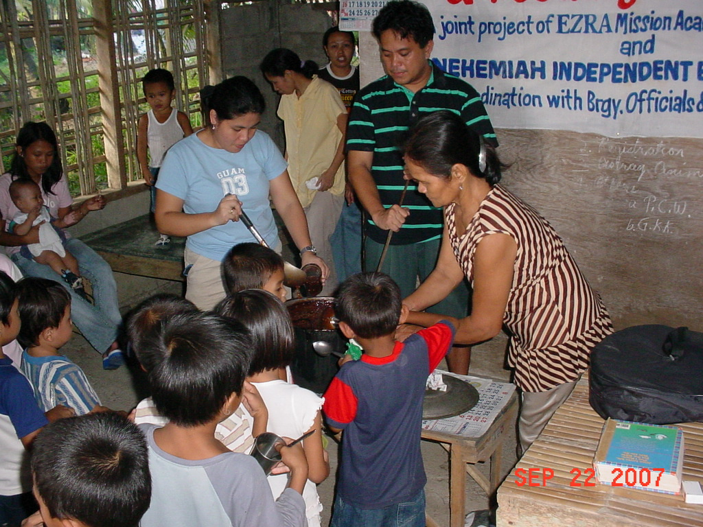Archived moment from a community feeding, health, or family outreach activity