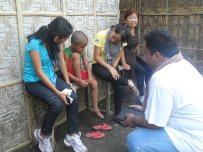 Archived moment from a community feeding, health, or family outreach activity