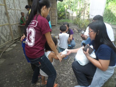 Archived moment from a community feeding, health, or family outreach activity