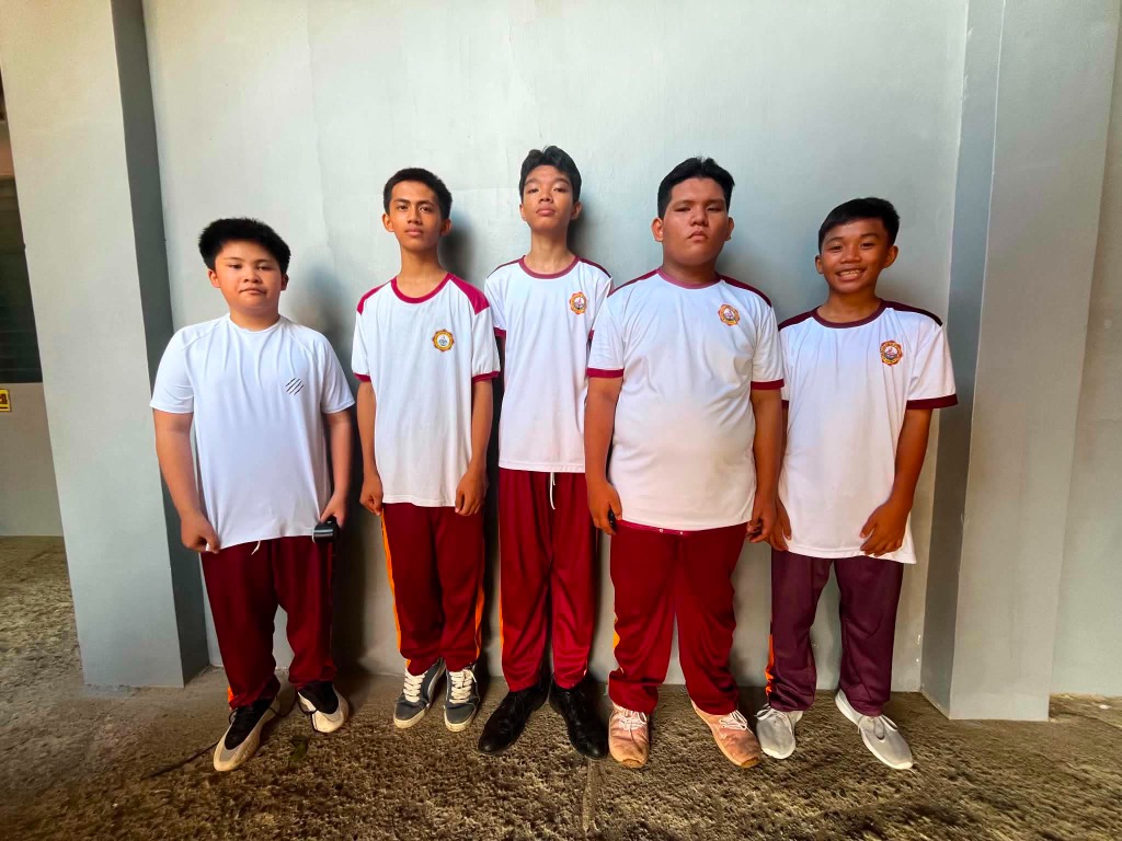 Male students of Ezra Mission Academy gathered together in uniform